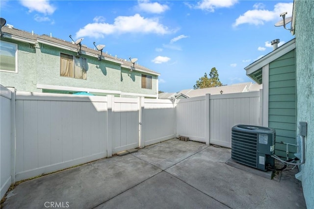 view of patio / terrace with a fenced backyard and cooling unit