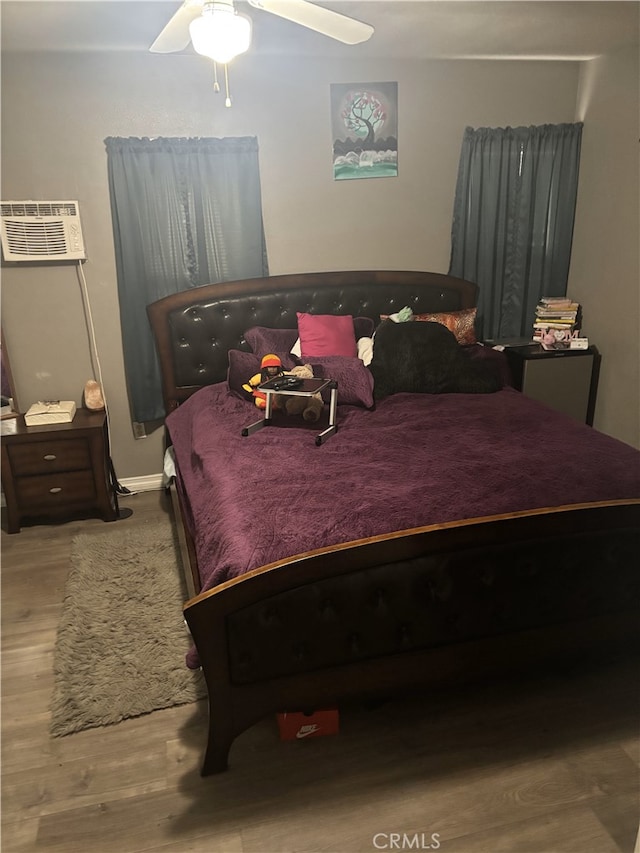 1391 N Crescent Ave, San Bernardino, CA 92405 - bedroom featuring wood finished floors, ceiling fan, and a wall mounted AC