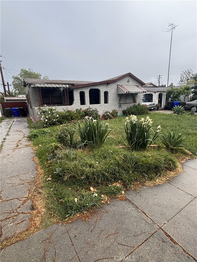 1391 N Crescent Ave, San Bernardino, CA 92405 - view of front facade featuring stucco siding and driveway