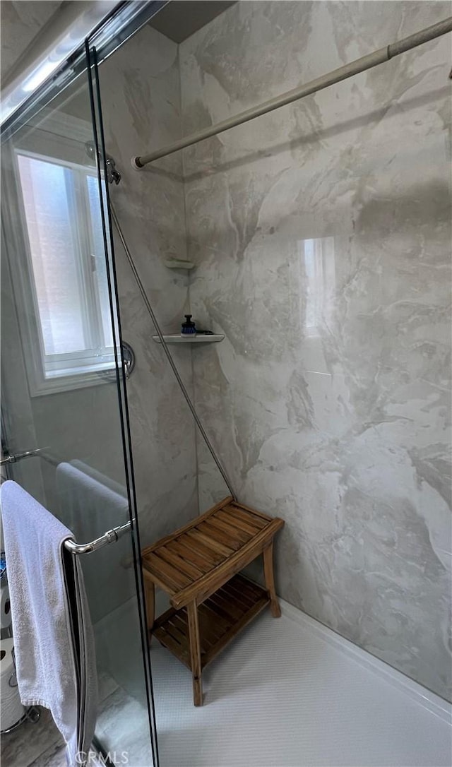 bathroom with a shower stall