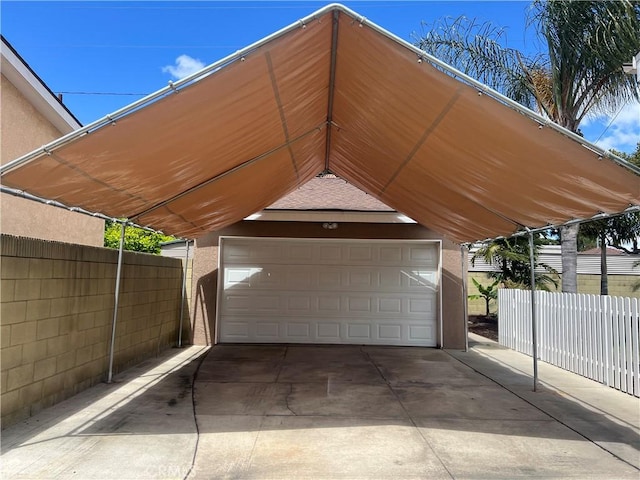 garage featuring fence