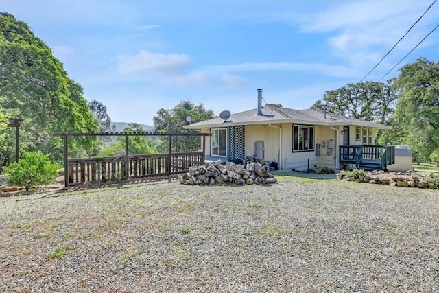 back of house featuring covered porch