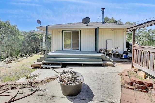 back of house with a patio and a wooden deck