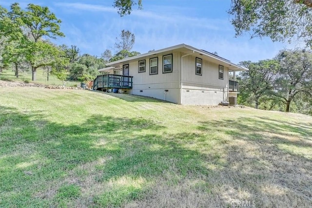exterior space featuring crawl space, central AC unit, and a lawn