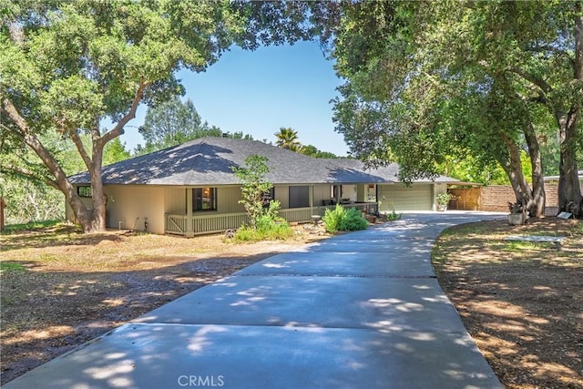 9553 Durango Rd, Atascadero, CA 93422 - view of front facade with a porch, driveway, a garage, fence, and roof with shingles