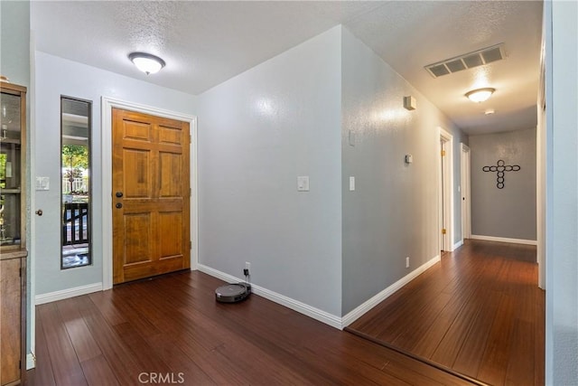 9553 Durango Rd, Atascadero, CA 93422 - entrance foyer featuring dark wood finished floors, baseboards, and a textured ceiling