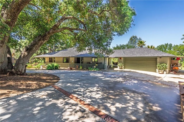 9553 Durango Rd, Atascadero, CA 93422 - ranch-style house with covered porch, concrete driveway, an attached garage, and a shingled roof