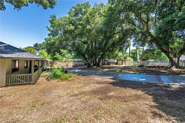 9553 Durango Rd, Atascadero, CA 93422 - view of yard with fence, a shed, and an outbuilding