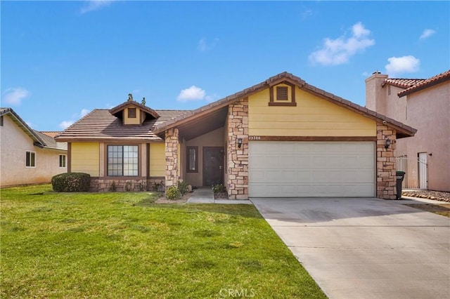 ranch-style house featuring driveway, a tile roof, stone siding, a front yard, and a garage