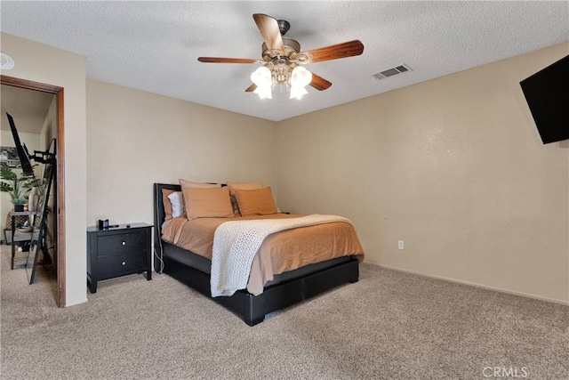 bedroom featuring light colored carpet, visible vents, ceiling fan, and baseboards