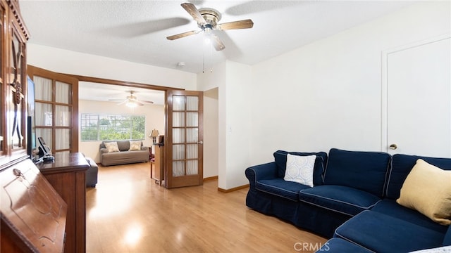 8737 Tilmont Ave, Pico Rivera, CA 90660 - living area featuring ceiling fan, french doors, and light wood finished floors