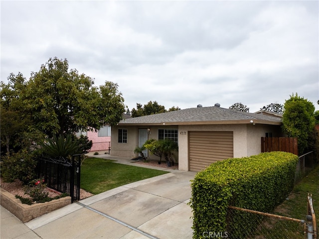 8737 Tilmont Ave, Pico Rivera, CA 90660 - view of front facade with fence, a front lawn, concrete driveway, an attached garage, and stucco siding