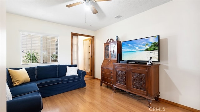 8737 Tilmont Ave, Pico Rivera, CA 90660 - living room with baseboards, a ceiling fan, light wood-style flooring, and visible vents