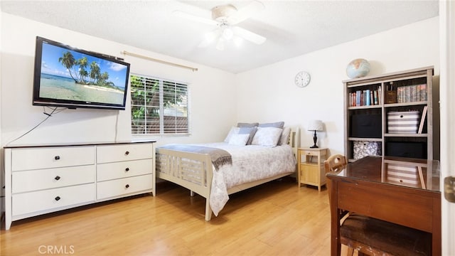 8737 Tilmont Ave, Pico Rivera, CA 90660 - bedroom featuring light wood-style floors, ceiling fan, and a textured ceiling