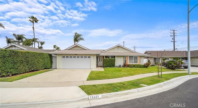 ranch-style house with an attached garage, concrete driveway, and a front lawn
