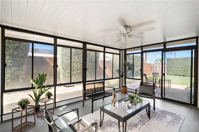 sunroom / solarium featuring an outdoor living space and a ceiling fan