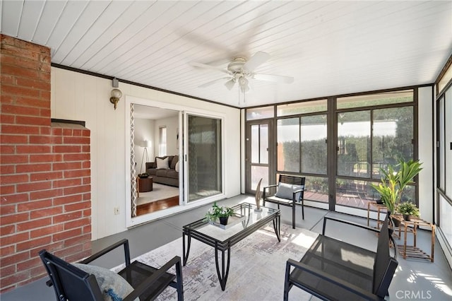 sunroom / solarium with outdoor lounge area and a ceiling fan