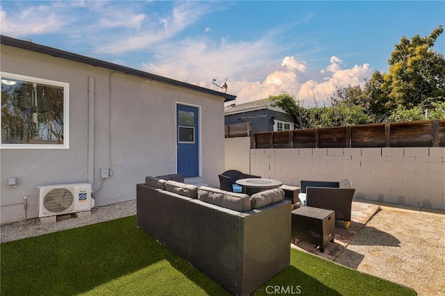 view of patio / terrace with fence, ac unit, and an outdoor living space