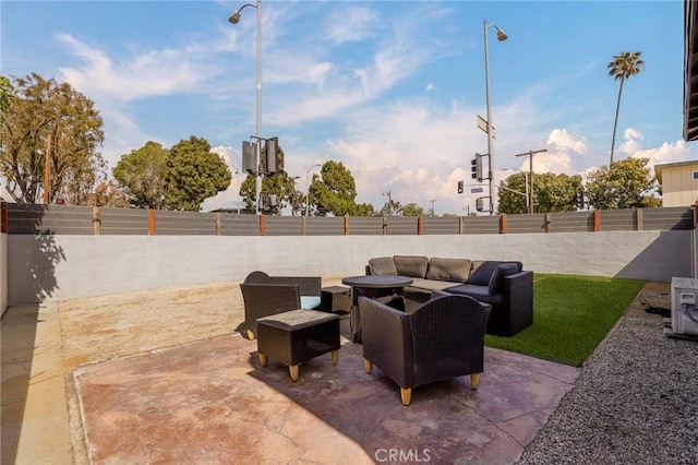 view of patio / terrace with an outdoor hangout area and a fenced backyard