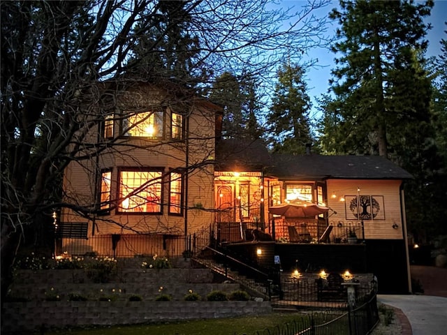 back of house featuring stairs
