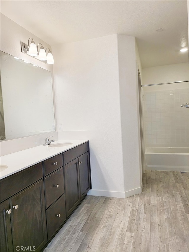 368 Arpent Ct, Merced, CA 95341 - bathroom with double vanity, wood finished floors, and shower / bath combination