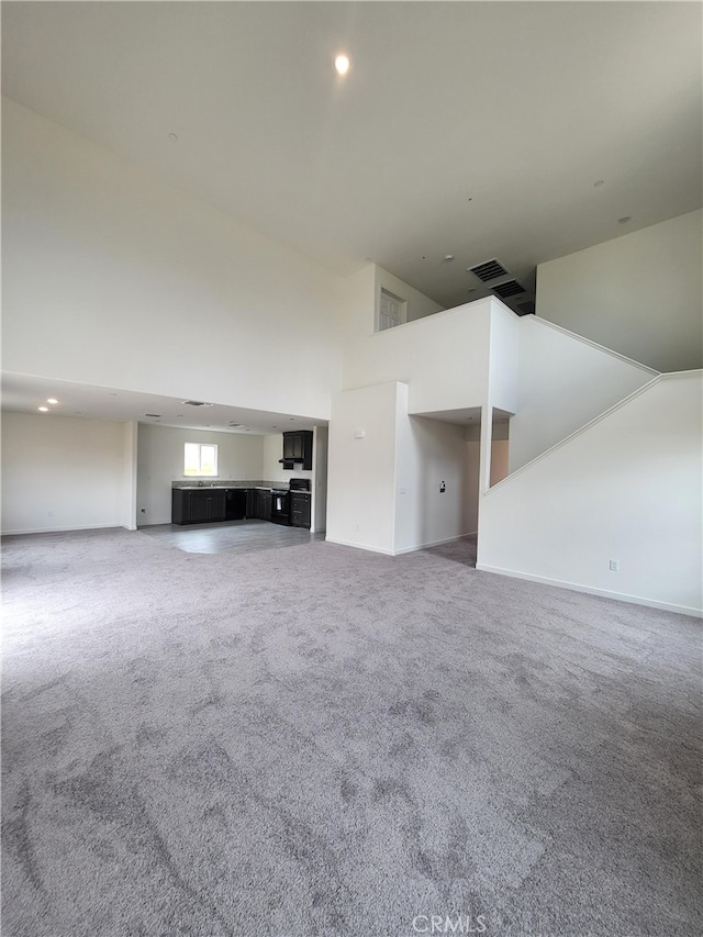 368 Arpent Ct, Merced, CA 95341 - unfurnished living room with high vaulted ceiling, carpet, and recessed lighting