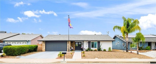 26414 Mehaffey St, Menifee, CA 92586 - ranch-style home with a garage, solar panels, and driveway