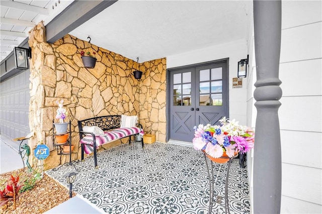 26414 Mehaffey St, Menifee, CA 92586 - doorway to property featuring a porch, french doors, and stone siding