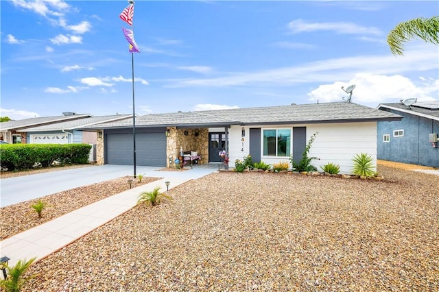26414 Mehaffey St, Menifee, CA 92586 - single story home featuring a garage, concrete driveway, and stone siding