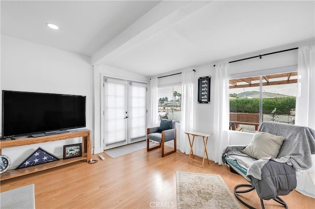 26414 Mehaffey St, Menifee, CA 92586 - sitting room with wood finished floors, a healthy amount of sunlight, recessed lighting, and beamed ceiling