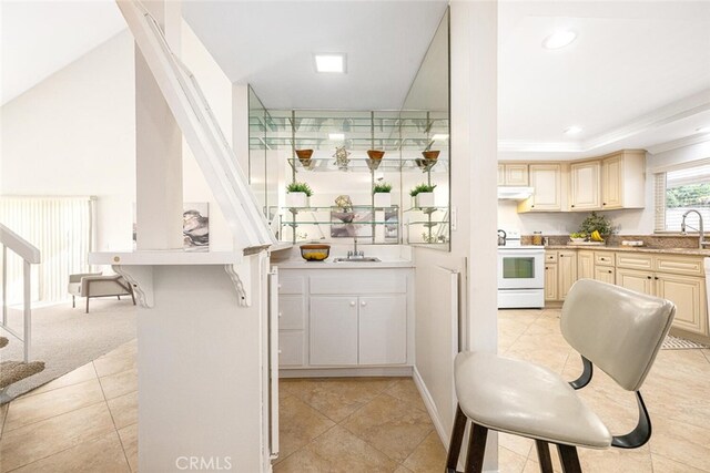 4200 Avenida Sevilla, Cypress, CA 90630 - indoor wet bar featuring white electric stove, under cabinet range hood, recessed lighting, and light tile patterned floors
