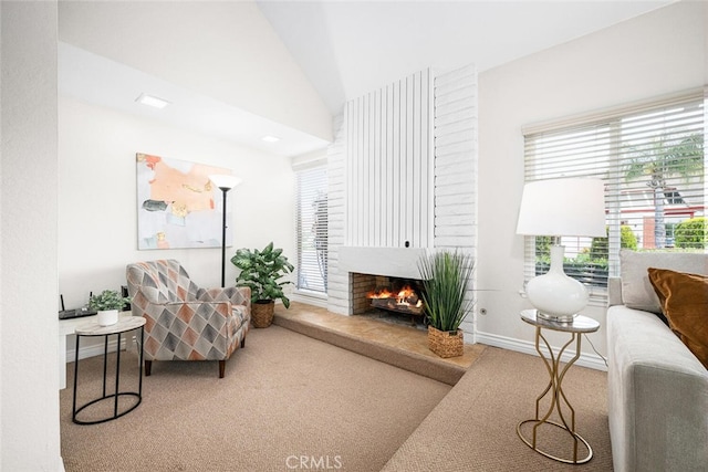 4200 Avenida Sevilla, Cypress, CA 90630 - living room featuring carpet floors, a lit fireplace, and vaulted ceiling