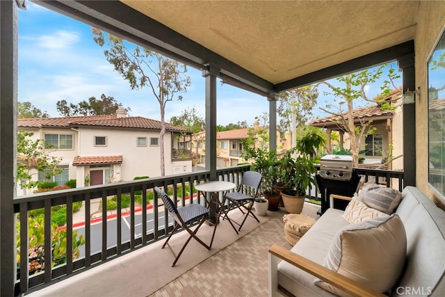 balcony featuring a residential view and a grill