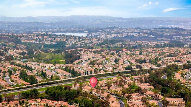 birds eye view of property with a mountain view