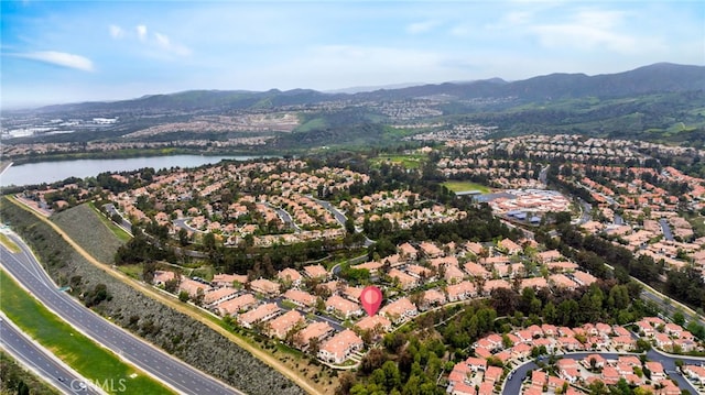 bird's eye view featuring a water and mountain view and a residential view