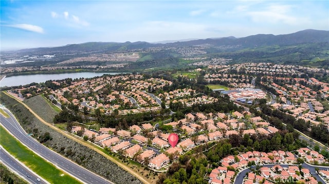 aerial view with a water and mountain view and a residential view