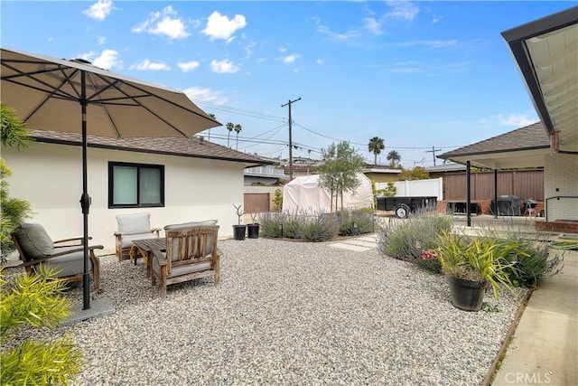 view of yard with a patio and fence