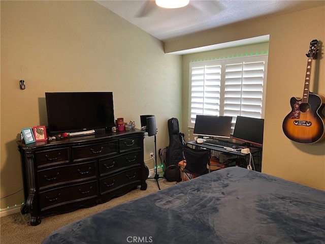 bedroom featuring a ceiling fan and light carpet