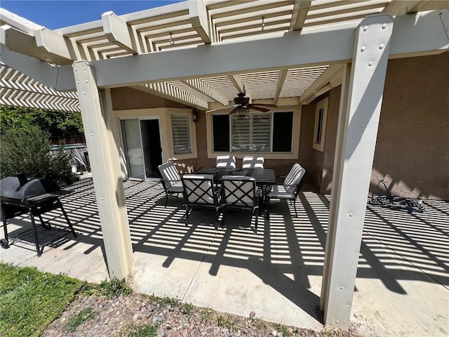 view of patio / terrace with a pergola, ceiling fan, and outdoor dining space