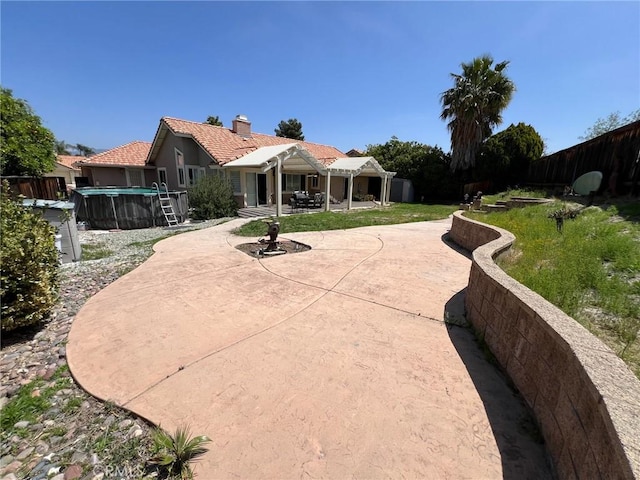surrounding community with a fenced backyard, a swimming pool, and a patio area