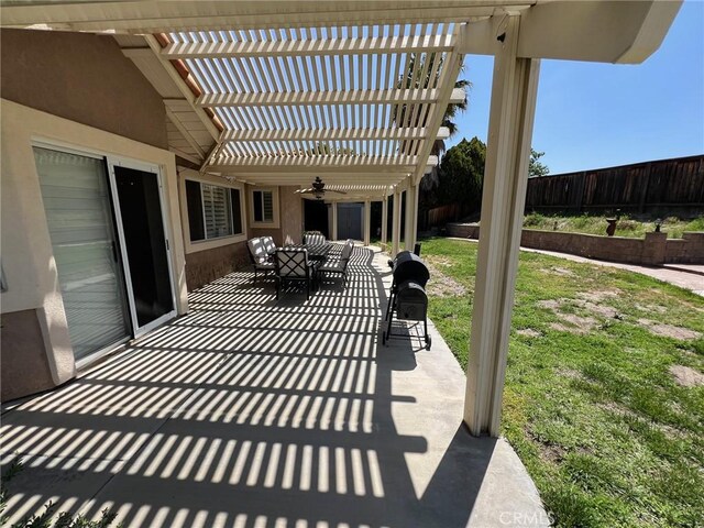 view of patio with a fenced backyard, a ceiling fan, and a pergola