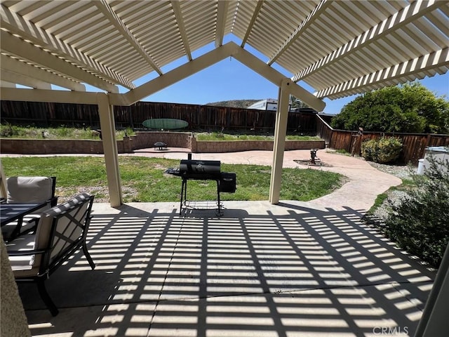 view of patio with a pergola, a fenced backyard, and a grill