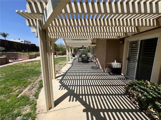 view of patio with fence and a pergola