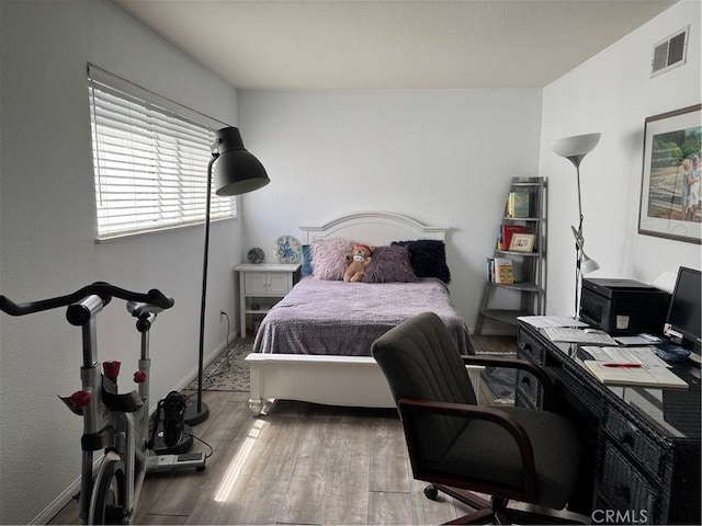 1036 Sea Breeze Dr Unit 4, Costa Mesa, CA 92627 - bedroom with wood finished floors, a desk, and baseboards