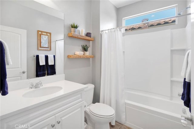 bathroom with toilet, shower / bath combo with shower curtain, and vanity