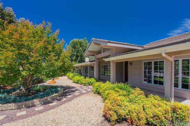 view of home's exterior with stucco siding