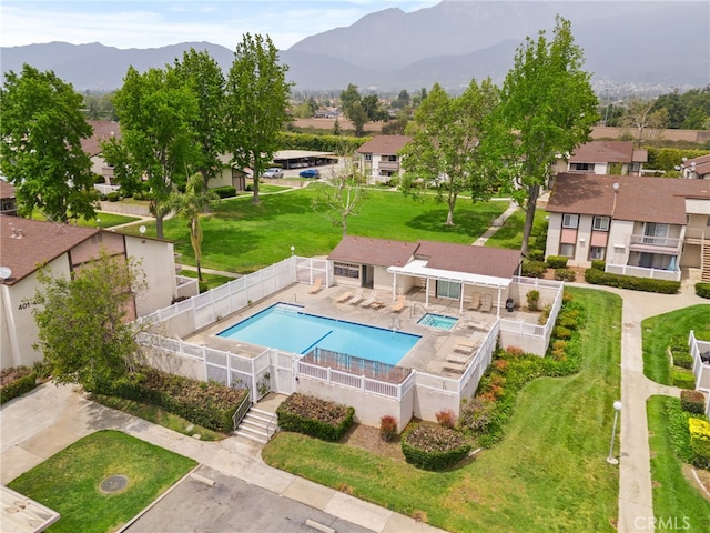 8990 19th St Unit 433, Rancho Cucamonga, CA 91701 - pool featuring a fenced backyard, a mountain view, a yard, and a residential view