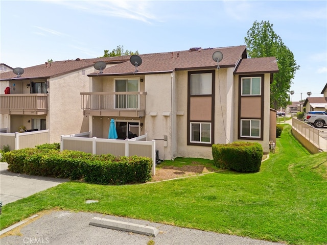 8990 19th St Unit 433, Rancho Cucamonga, CA 91701 - view of building exterior with uncovered parking and fence