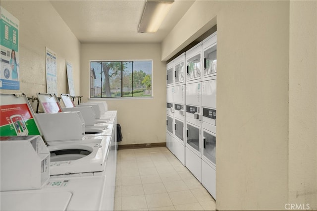 8990 19th St Unit 433, Rancho Cucamonga, CA 91701 - shared laundry area with separate washer and dryer, stacked washer and clothes dryer, baseboards, and light tile patterned floors