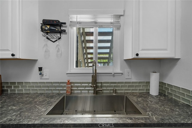 8990 19th St Unit 433, Rancho Cucamonga, CA 91701 - details with a sink, white cabinetry, dark stone counters, and tasteful backsplash